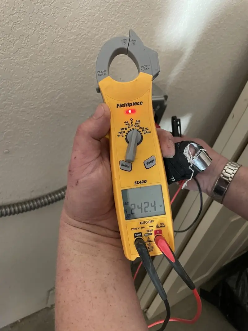 Voltage testing with clamp meter during Outlet Installation in Ruidoso